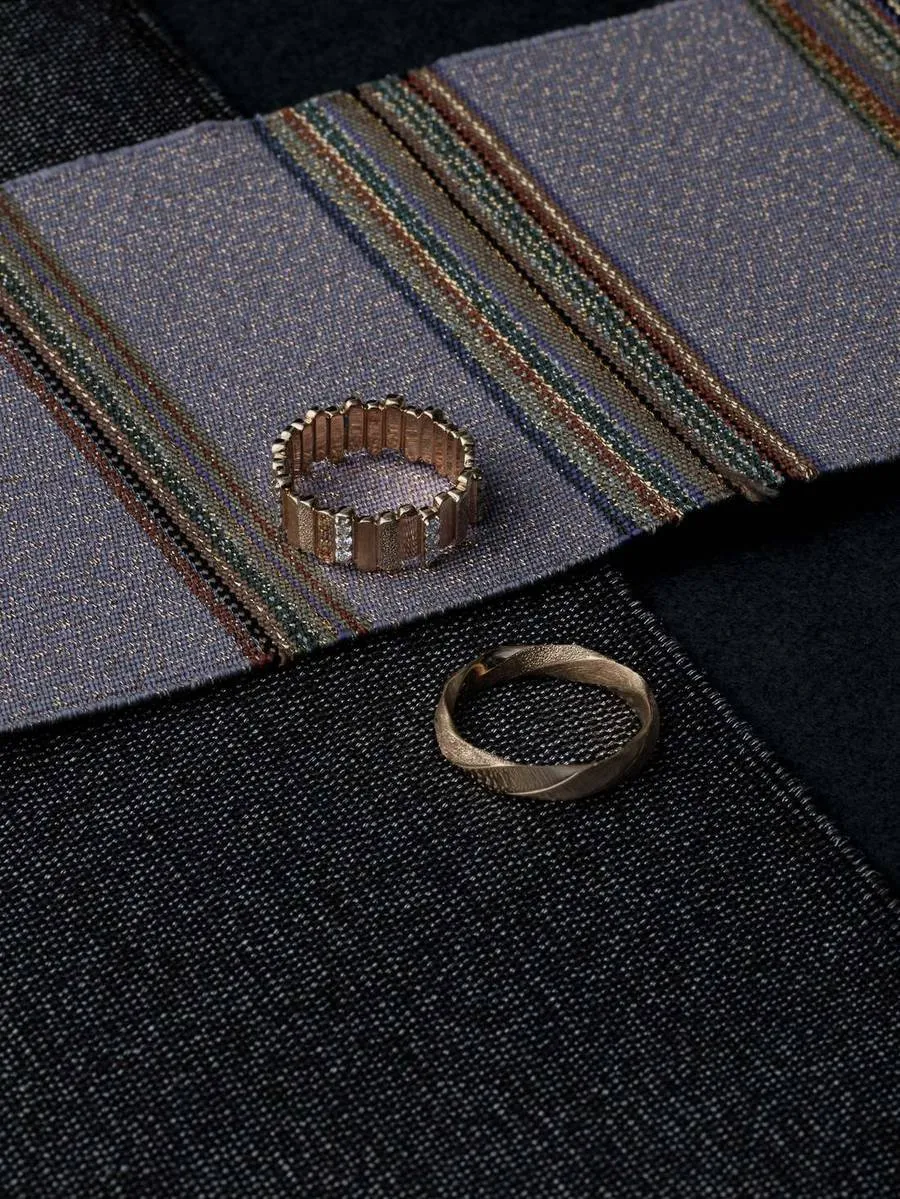 ARCELF rings resting on a woven textile