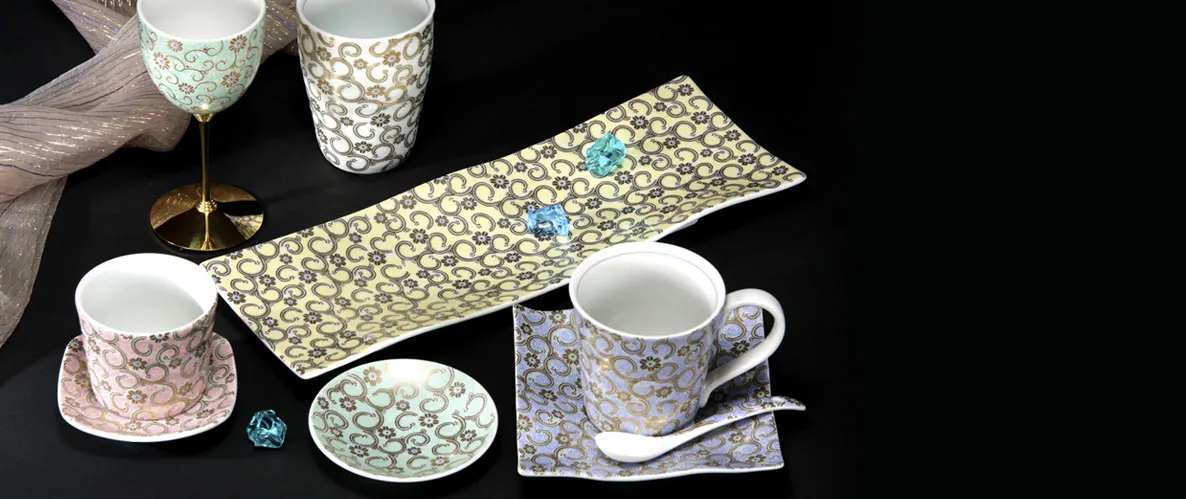 A selection of colorful Kutani ware cups and plates from Shimada Toki